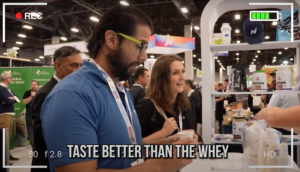 Sergio Hank at the NiHTEK® booth during the Vegas Protein Challenge, experiencing the taste and performance of NiHPRO®.