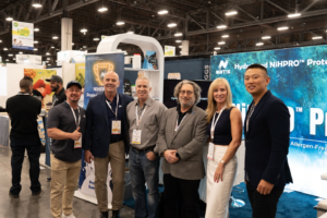 Mark Post at the NiHTEK® booth during the Vegas Protein Challenge, highlighting NiHPRO® as the perfect protein for women – allergen-free, smooth, and delicious.