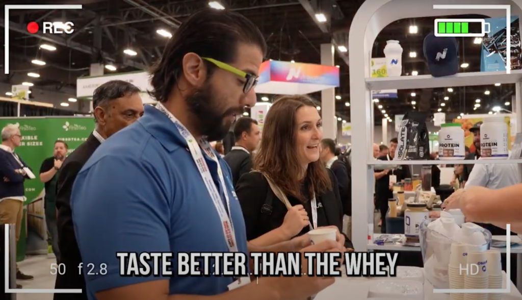 Sergio Hank at the NiHTEK® booth during the Vegas Protein Challenge, experiencing the taste and performance of NiHPRO®.
